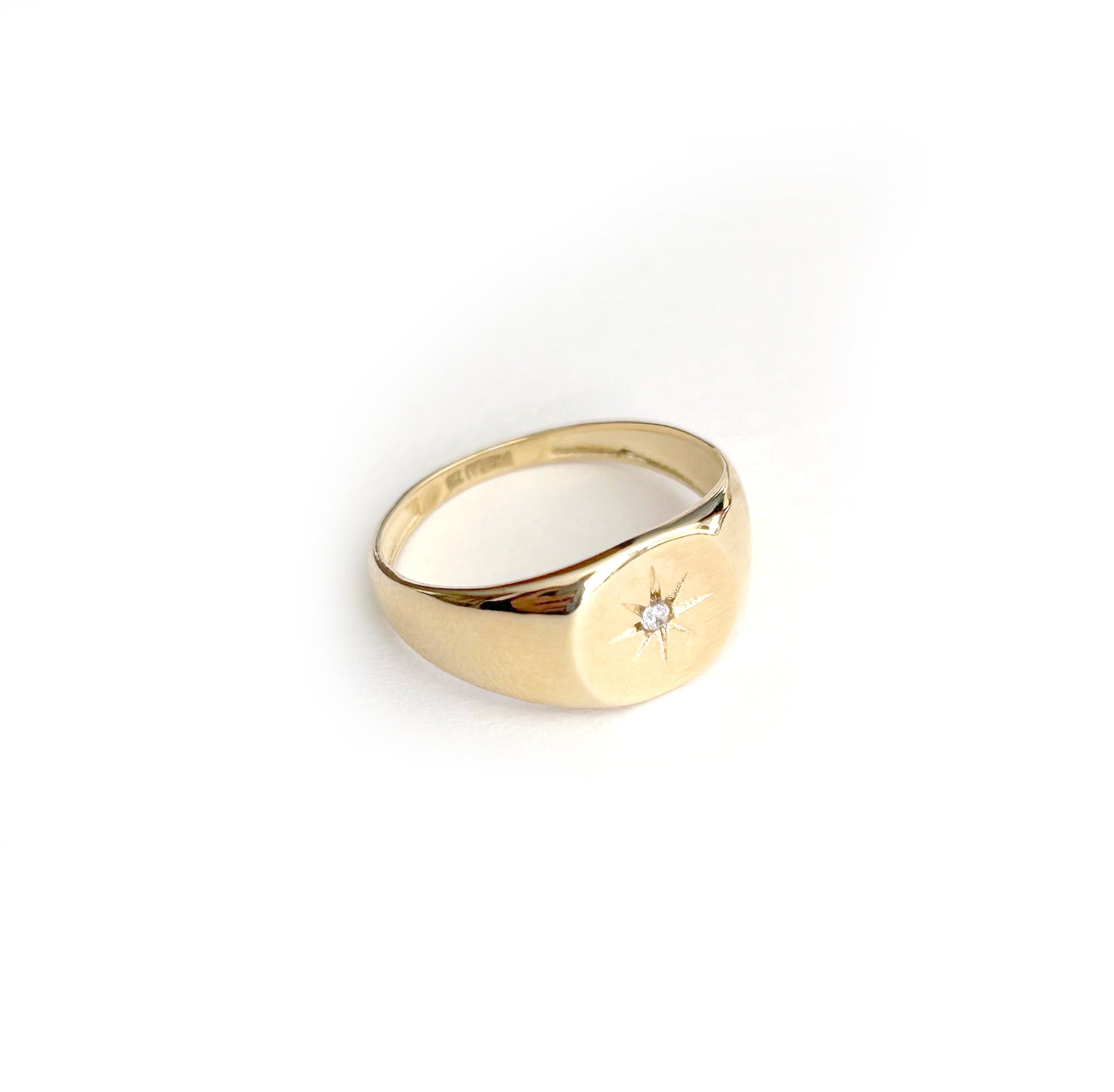 Mini Starburst Signet Ring | 
                    18-karat gold and high quality of cubic zirconia stones.