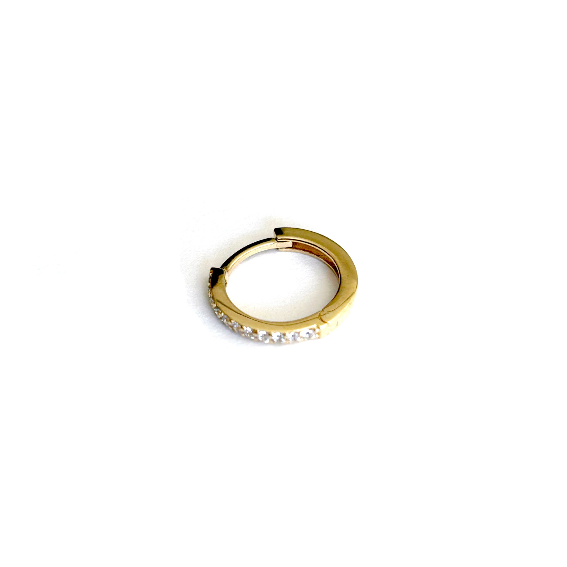 Huggie Hoop 10mm | 
                    18-karat gold and high quality of cubic zirconia stones.